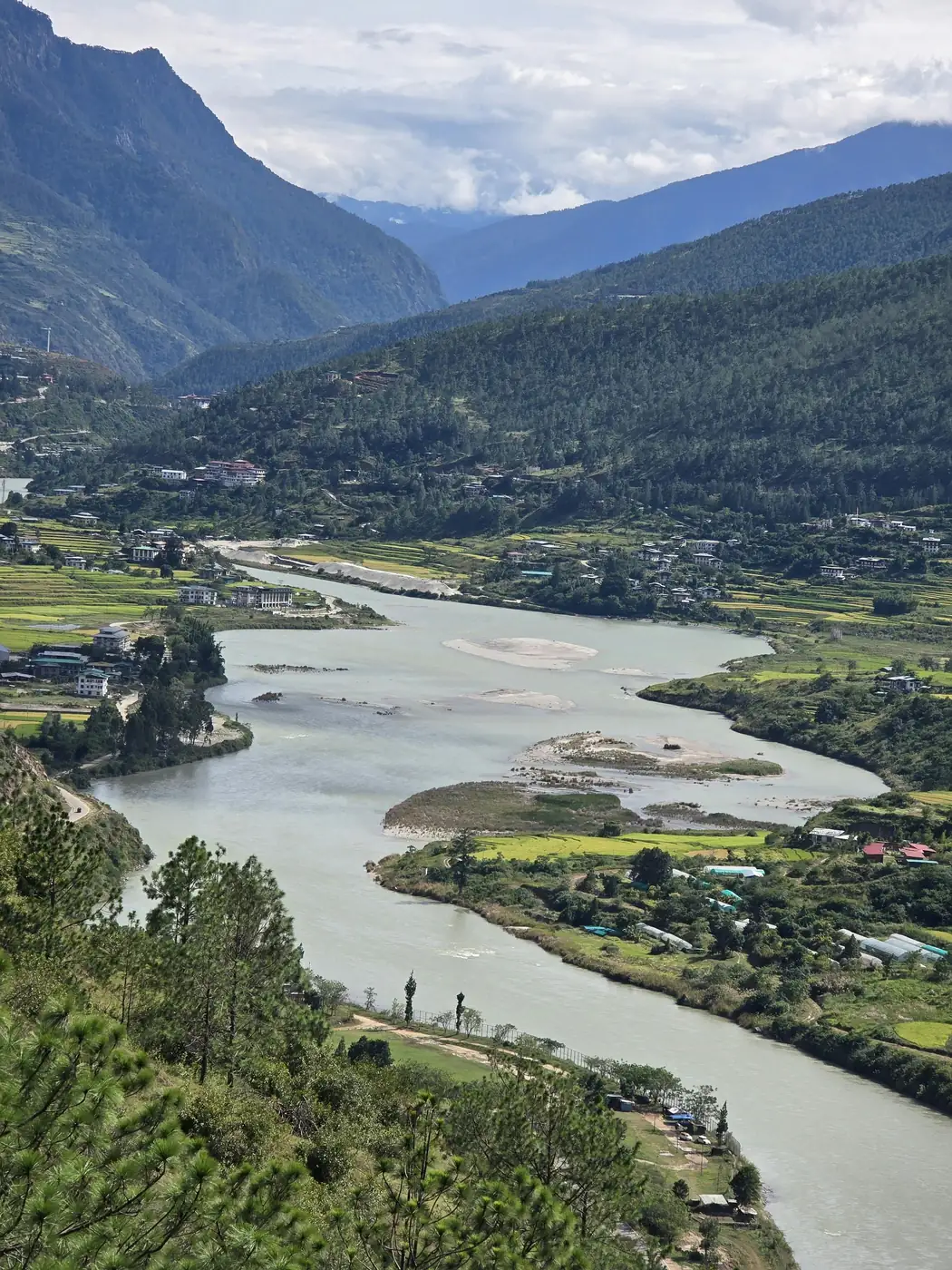 Bumthang valley with farmhouses and prayer flags
