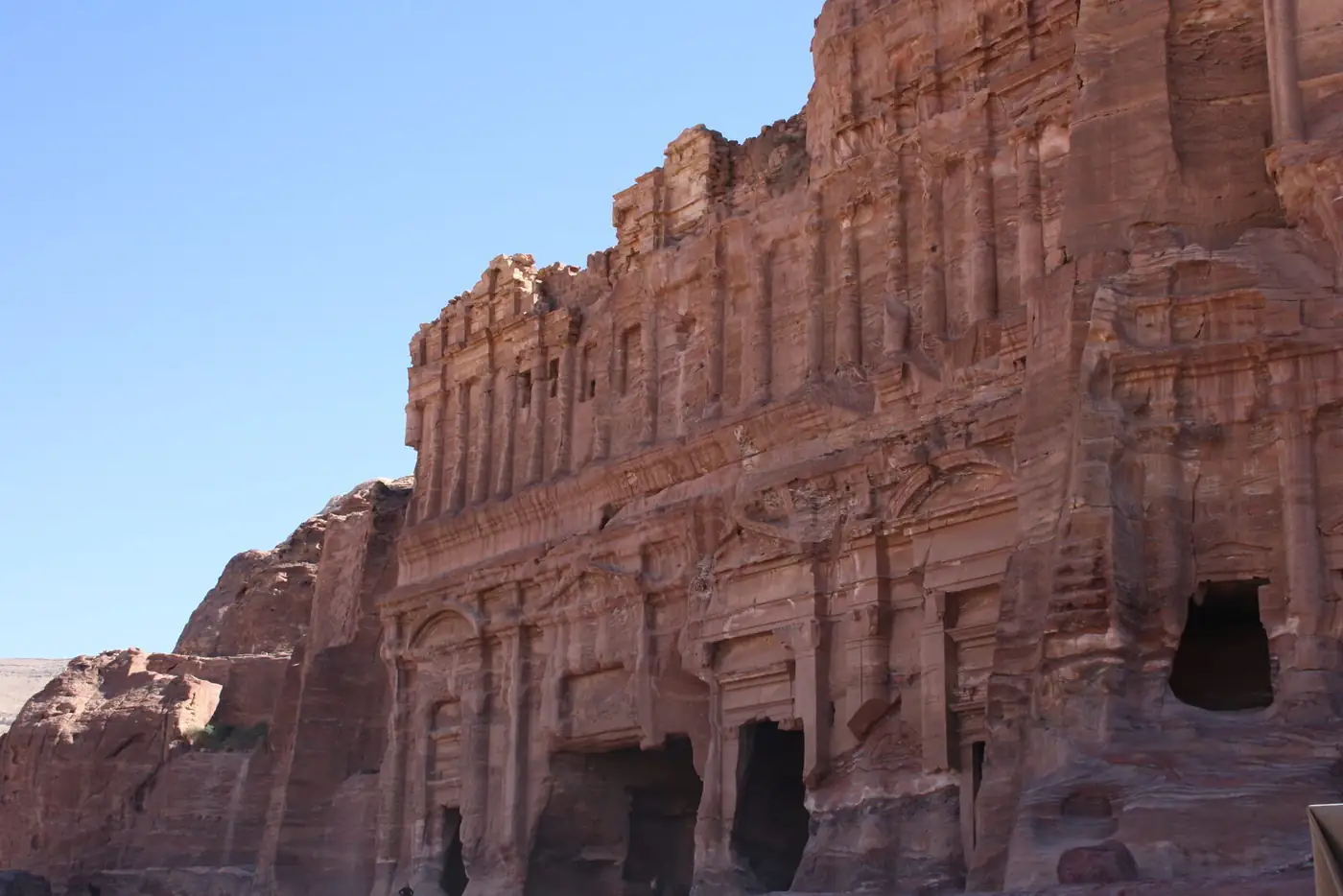 Nabataean tombs carved into rose-red sandstone at Hegra, AlUla