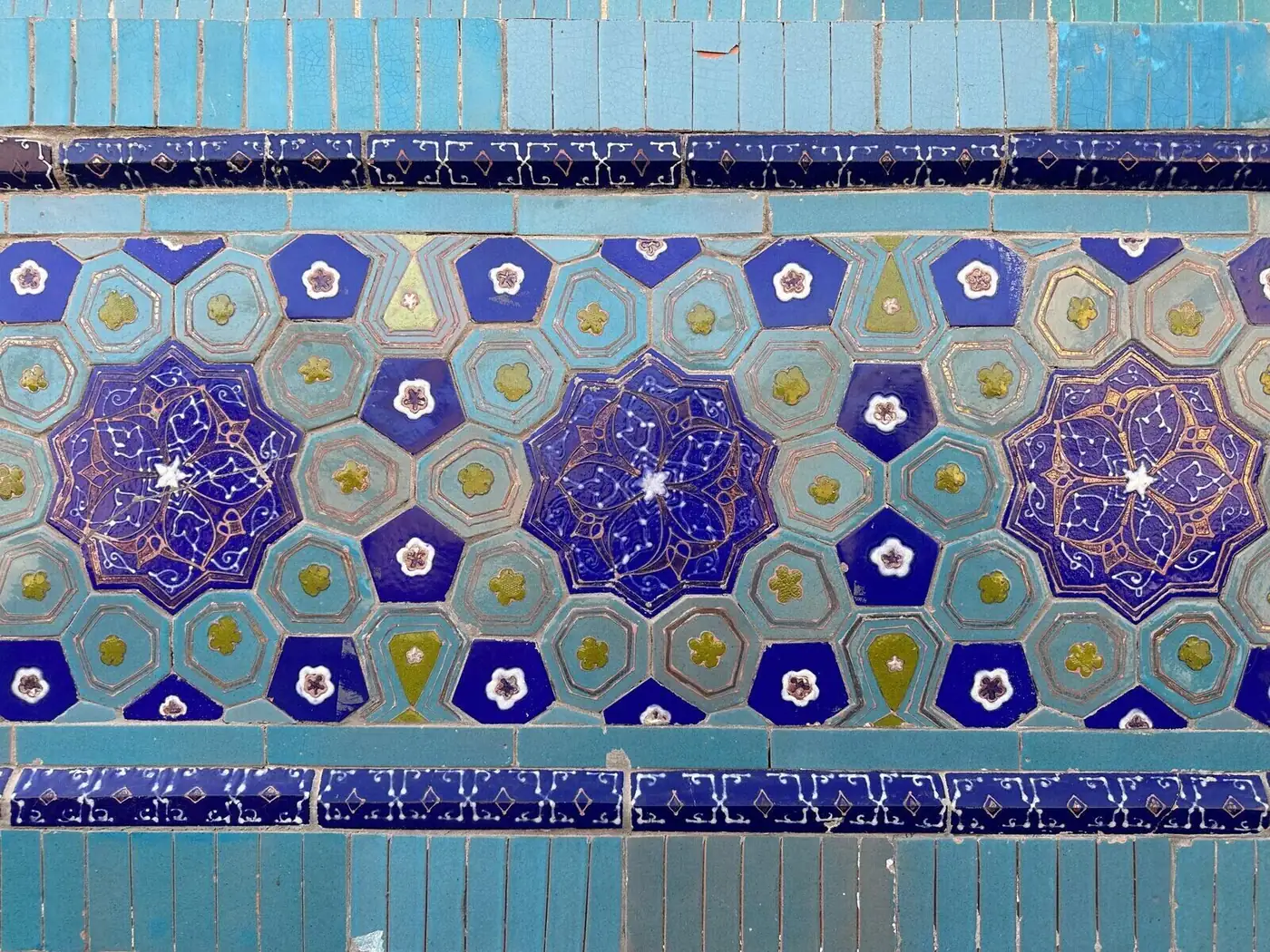 Detail of Shah-i-Zinda tilework — geometric patterns in turquoise, cobalt and white